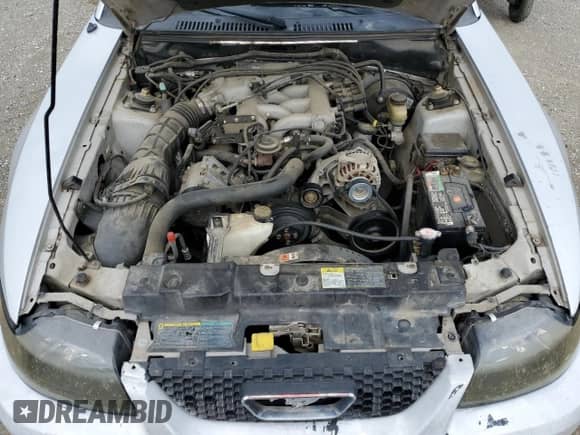 2004 Ford Mustang Deluxe z VIN 1FAFP44494F117692, wystawiony jako Copart lot #56503755 z przebiegiem 159 917 mil mil oraz Szkoda całkowita • Salvage title. Historia ofert i sprzedaży dostępna na DreamBid. Obrazek 11.