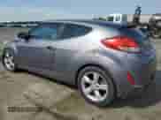 2013 Hyundai Veloster w/Black Int z VIN KMHTC6AD9DU095127, wystawiony jako Copart lot #70422785 z przebiegiem 188 309 mil mil oraz Szkoda całkowita • Salvage title. Historia ofert i sprzedaży dostępna na DreamBid. Obrazek 2.