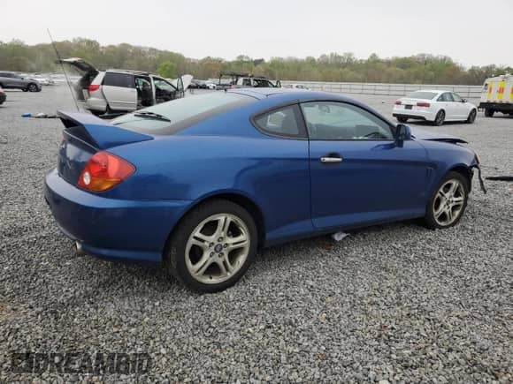 2004 Hyundai Tiburon GT with VIN KMHHN65F04U116166, listed as a Copart auction lot 51525065 with 153,035 mi miles and Salvage title. Bid and sale history available at DreamBid. Image 3.