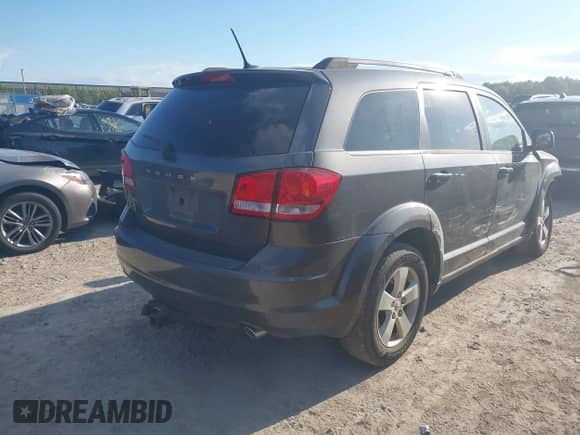 2014 Dodge Journey SE with VIN 3C4PDDAG5ET279249, listed as a IAAI auction lot 43113809 with 205,829 mi miles and . Bid and sale history available at DreamBid. Image 4.