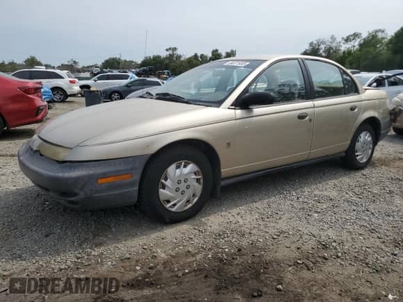 1999 Saturn SL z VIN 1G8ZH5283XZ349797, wystawiony jako Copart lot #58221955 z przebiegiem 148 506 mil mil oraz Nie do naprawy • Non repairable. Historia ofert i sprzedaży dostępna na DreamBid. Obrazek 1.