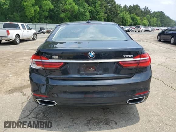 2017 BMW 7 Series 750i with VIN WBA7F0C52HGM21318, listed as a Copart auction lot 57333425 with 77,022 mi miles and Salvage title. Bid and sale history available at DreamBid. Image 6.