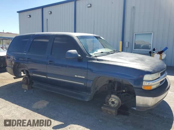 2001 Chevrolet Tahoe LS with VIN 1GNEC13T01R199886, listed as a Copart auction lot 64245125 with 242,201 mi miles and Salvage title. Bid and sale history available at DreamBid. Image 4.