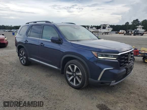 2023 Honda Pilot Elite with VIN 5FNYG1H84PB001369, listed as a Copart auction lot 65093155 with 24,260 mi miles and Salvage title. Bid and sale history available at DreamBid. Image 4.