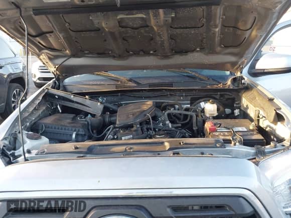 2018 Toyota Tacoma SR with VIN 5TFRX5GN8JX117075, listed as a IAAI auction lot 41723001 with 67,559 mi miles and . Bid and sale history available at DreamBid. Image 10.