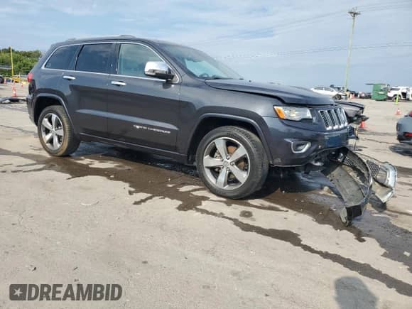 2015 Jeep Grand Cherokee Overland with VIN 1C4RJECG2FC872164, listed as a Copart auction lot 69685435 with 140,939 mi miles and Salvage title. Bid and sale history available at DreamBid. Image 4.