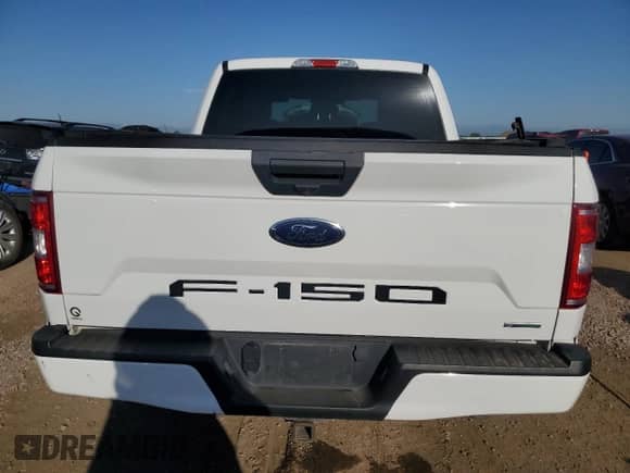 2020 Ford F-150 XL with VIN 1FTEW1CPXLFA15710, listed as a Copart auction lot 61944055 with 98,561 mi miles and Salvage title. Bid and sale history available at DreamBid. Image 6.