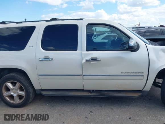 2014 Chevrolet Suburban LTZ with VIN 1GNSCKE08ER150520, listed as a IAAI auction lot 42236005 with 215,013 mi miles and . Bid and sale history available at DreamBid. Image 13.