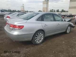 2009 Hyundai Azera GLS z VIN KMHFC46D89A360798, wystawiony jako Copart lot #60381093 z przebiegiem 151 626 mil mil oraz Szkoda całkowita • Salvage title. Historia ofert i sprzedaży dostępna na DreamBid. Obrazek 3.