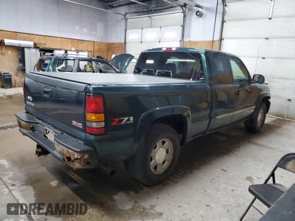 2004 GMC Sierra 1500 SLT z VIN 2GTEK19T941194072, wystawiony jako Copart lot #70002765 z przebiegiem 165 447 mil mil oraz Szkoda całkowita • Salvage title. Historia ofert i sprzedaży dostępna na DreamBid. Obrazek 3.