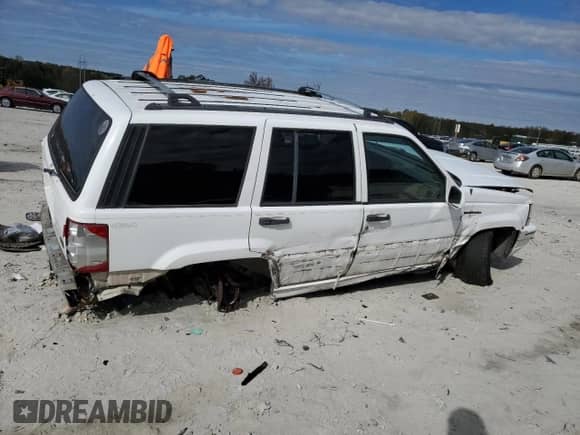 1995 Jeep Grand Cherokee Limited with VIN 1J4GZ78Y2SC788413, listed as a Copart auction lot 80297444 with 309,566 mi miles and Salvage title. Bid and sale history available at DreamBid. Image 3.