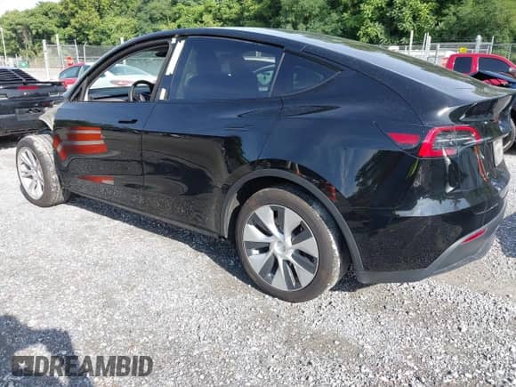 2023 Tesla Model Y Long Range with VIN 7SAYGDEE7PF825882, listed as a IAAI auction lot 42975990 with 44,109 mi miles and . Bid and sale history available at DreamBid. Image 3.