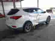2018 Hyundai Santa Fe 2.4L z VIN 5XYZT3LB5JG516329, wystawiony jako IAAI lot #43392532 z przebiegiem 94 128 mil mil oraz . Historia ofert i sprzedaży dostępna na DreamBid. Obrazek 4.
