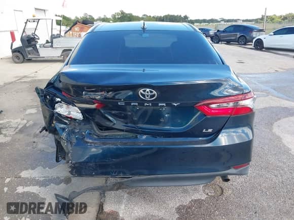 2021 Toyota Camry LE with VIN 4T1C11AK2MU534448, listed as a IAAI auction lot 43111658 with 89,877 mi miles and . Bid and sale history available at DreamBid. Image 16.