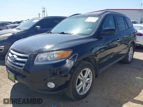 2012 Hyundai Santa Fe Limited with VIN 5XYZK3AB5CG135850, listed as a IAAI auction lot 42797538 with 114,344 mi miles and . Bid and sale history available at DreamBid. Image 2.