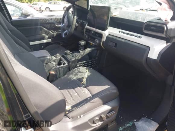 2024 Toyota Tacoma SR5 with VIN 3TMLB5JN4RM054958, listed as a IAAI auction lot 43047601 with 15,429 mi miles and . Bid and sale history available at DreamBid. Image 5.