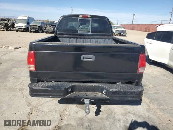 2003 Dodge Dakota Sport z VIN 1D7HL38N03S172331, wystawiony jako Copart lot #78851764 z przebiegiem 162 521 mil mil oraz Czysty tytuł • Clean title. Historia ofert i sprzedaży dostępna na DreamBid. Obrazek 6.