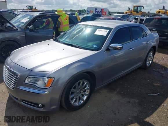 2014 Chrysler 300 C with VIN 2C3CCAETXEH109067, listed as a IAAI auction lot 42596910 with 150,337 mi miles and . Bid and sale history available at DreamBid. Image 18.