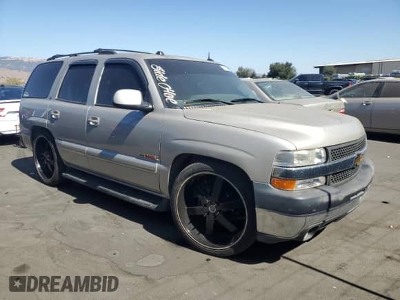 2004 Chevrolet Tahoe LS with VIN 1GNEC13T74R151824, listed as a Copart auction lot 70682005 with 204,620 mi miles and Salvage title. Bid and sale history available at DreamBid. Image 4.