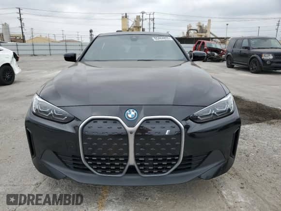 2024 BMW i4 eDrive35 with VIN WBY43AW05RFS57427, listed as a Copart auction lot 65464855 with 7,096 mi miles and Salvage title. Bid and sale history available at DreamBid. Image 5.