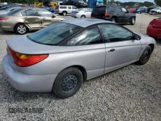 2001 Saturn SC с VIN 1G8ZP12851Z215716, выставлен на аукционе Copart как лот 69665754 с пробегом Не указан миль и Списание • Salvage title. История ставок и продаж доступна на DreamBid. Изображение 3.