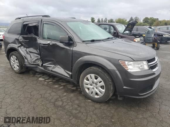 2017 Dodge Journey SE z VIN 3C4PDCAB3HT521944, wystawiony jako Copart lot #87031525 z przebiegiem 84 615 mil mil oraz Szkoda całkowita • Salvage title. Historia ofert i sprzedaży dostępna na DreamBid. Obrazek 4.