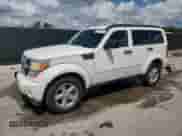 2007 Dodge Nitro SXT with VIN 1D8GU28K27W661610, listed as a Copart auction lot 81045195 with 153,517 mi miles and Salvage title. Bid and sale history available at DreamBid. Image 1.