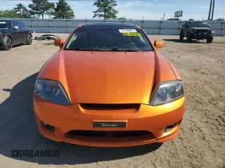 2006 Hyundai Tiburon GT с VIN KMHHN65FX6U221882, выставлен на аукционе Copart как лот 57456825 с пробегом 203 312 миль миль и Списание • Salvage title. История ставок и продаж доступна на DreamBid. Изображение 5.