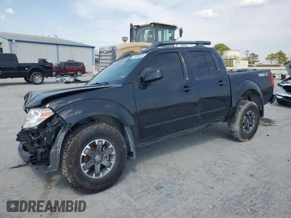 2021 Nissan Frontier Pro-4X with VIN 1N6ED0EBXMN704555, listed as a Copart auction lot 71824015 with 76,858 mi miles and Salvage title. Bid and sale history available at DreamBid. Image 1.