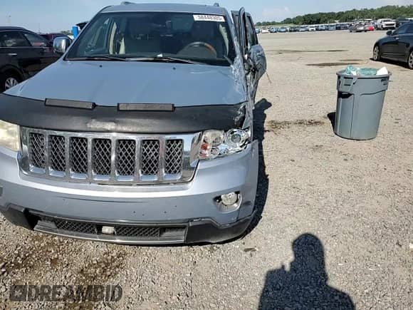 2012 Jeep Grand Cherokee Overland with VIN 1C4RJECG2CC354373, listed as a Copart auction lot 58448305 with 226,012 mi miles and Salvage title. Bid and sale history available at DreamBid. Image 12.