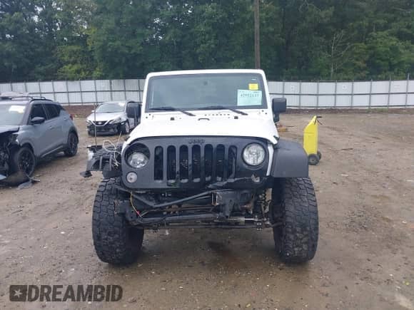 2015 Jeep Wrangler Sport with VIN 1C4AJWAG1FL593777, listed as a IAAI auction lot 42952137 with 99,393 mi miles and . Bid and sale history available at DreamBid. Image 6.