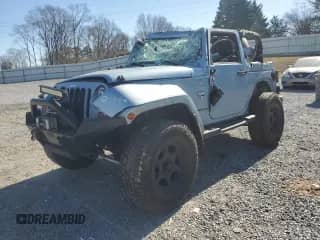 2012 Jeep Wrangler Sahara with VIN 1C4GJWBG8CL170148, listed as a Copart auction lot 42392445 with 100,224 mi miles and Salvage title. Bid and sale history available at DreamBid. Image 1.