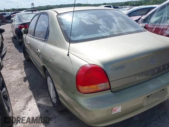 1999 Hyundai Sonata z VIN KMHWF25V0XA043097, wystawiony jako IAAI lot #42868882 z przebiegiem 234 840 mil mil oraz . Historia ofert i sprzedaży dostępna na DreamBid. Obrazek 3.
