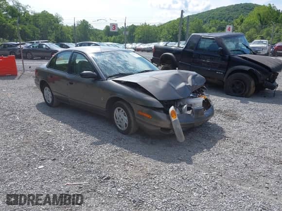 2001 Saturn SL with VIN 1G8ZF52851Z238231, listed as a IAAI auction lot 42454503 with 144,748 mi miles and . Bid and sale history available at DreamBid. Image 1.