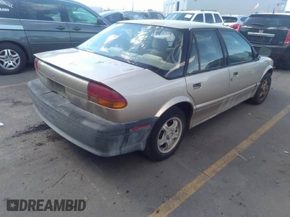 1994 Saturn SL с VIN 1G8ZF5591RZ223418, выставлен на аукционе IAAI как лот 35065902 с пробегом 185 890 миль миль и . История ставок и продаж доступна на DreamBid. Изображение 4.