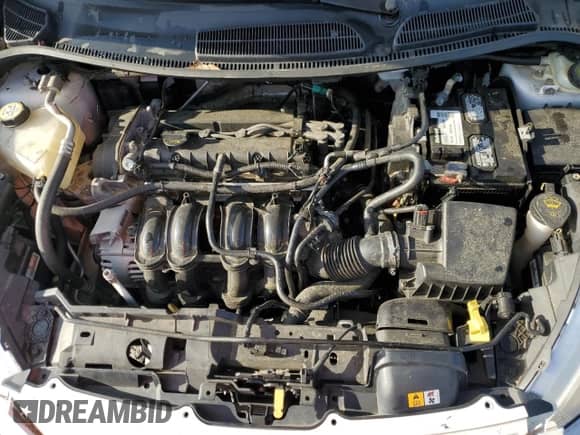 2013 Ford Fiesta S z VIN 3FADP4TJ1DM215176, wystawiony jako Copart lot #70181585 z przebiegiem 133 942 mil mil oraz Szkoda całkowita • Salvage title. Historia ofert i sprzedaży dostępna na DreamBid. Obrazek 11.