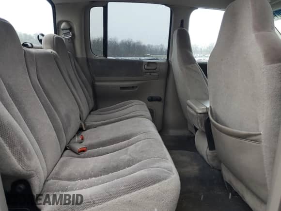 2003 Dodge Dakota Sport z VIN 1D7HG38X43S212335, wystawiony jako Copart lot #85670114 z przebiegiem 161 851 mil mil oraz Szkoda całkowita • Salvage title. Historia ofert i sprzedaży dostępna na DreamBid. Obrazek 10.