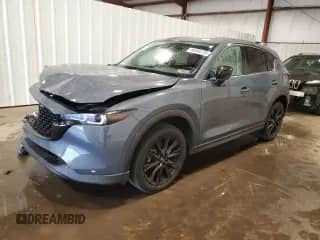 2022 Mazda CX-5 S Carbon Edition z VIN JM3KFBCM5N1606582, wystawiony jako Copart lot #86060735 z przebiegiem 55 444 mil mil oraz Szkoda całkowita • Salvage title. Historia ofert i sprzedaży dostępna na DreamBid. Obrazek 1.