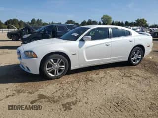 2014 Dodge Charger RT Plus with VIN 2C3CDXDT9EH339913, listed as a Copart auction lot 84621675 with 121,686 mi miles and Salvage title. Bid and sale history available at DreamBid. Image 1.