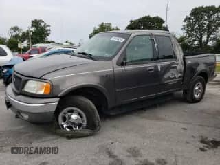 2002 Ford F-150 XLT with VIN 1FTRW08662KC45830, listed as a Copart auction lot 69485294 with 218,248 mi miles and Salvage title. Bid and sale history available at DreamBid. Image 1.