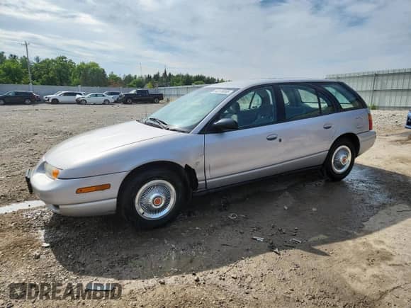 2001 Saturn SW with VIN 1G8ZJ82771Z275014, listed as a Copart auction lot 64273055 with 179,205 mi miles and Clean title. Bid and sale history available at DreamBid. Image 1.
