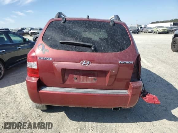 2005 Hyundai Tucson GL z VIN KM8JM12B75U119107, wystawiony jako Copart lot #71539895 z przebiegiem Nie podano mil oraz Szkoda całkowita • Salvage title. Historia ofert i sprzedaży dostępna na DreamBid. Obrazek 6.