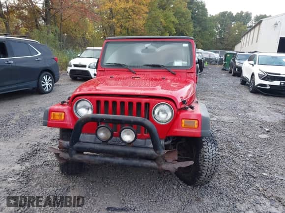 2002 Jeep Wrangler Sport z VIN 1J4FA49S92P715110, wystawiony jako IAAI lot #43455131 z przebiegiem 153 258 mil mil oraz . Historia ofert i sprzedaży dostępna na DreamBid. Obrazek 6.