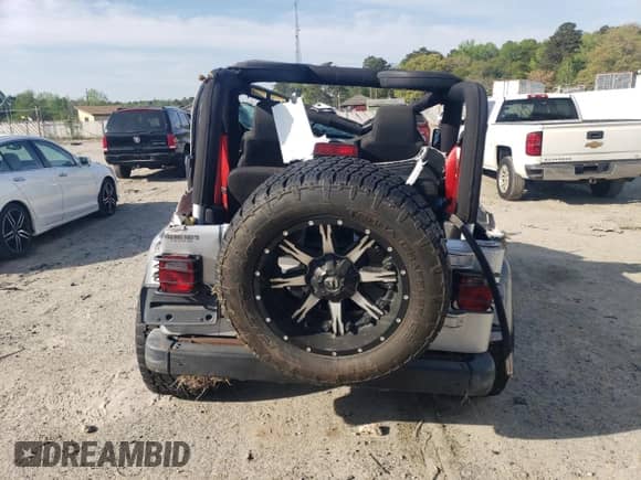 2003 Jeep Wrangler Rubicon с VIN 1J4FA69S53P375189, выставлен на аукционе Copart как лот 54292035 с пробегом 55 863 миль миль и Списание • Salvage title. История ставок и продаж доступна на DreamBid. Изображение 6.