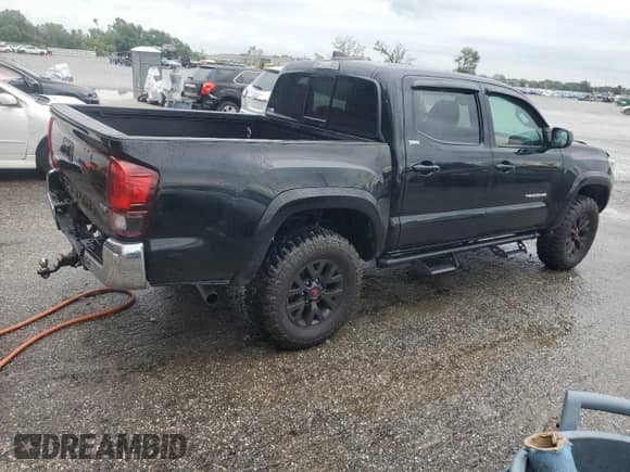 2022 Toyota Tacoma SR with VIN 3TMCZ5AN5NM511508, listed as a Copart auction lot 80245915 with 58,279 mi miles and Salvage title. Bid and sale history available at DreamBid. Image 3.