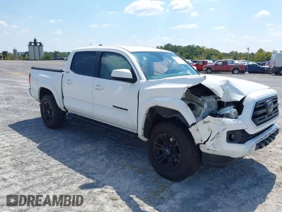 2018 Toyota Tacoma TRD Sport with VIN 3TMAZ5CN4JM063213, listed as a IAAI auction lot 43222181 with 82,040 mi miles and . Bid and sale history available at DreamBid. Image 1.