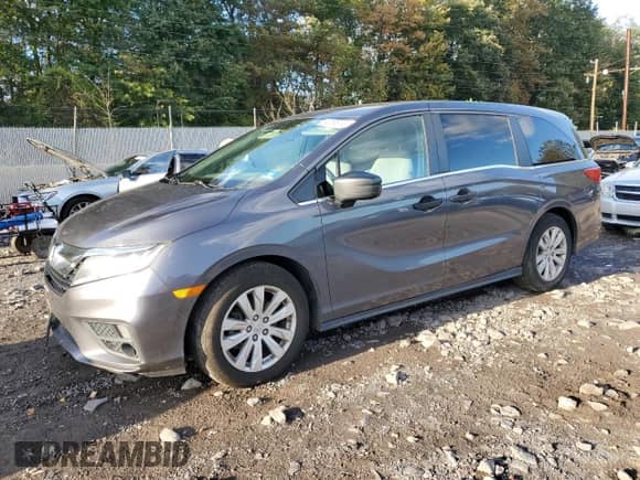 2020 Honda Odyssey LX with VIN 5FNRL6H20LB047462, listed as a Copart auction lot 82296145 with 61,618 mi miles and Salvage title. Bid and sale history available at DreamBid. Image 1.