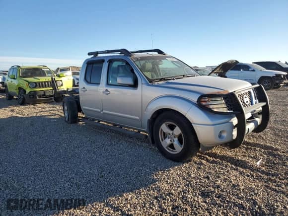 2006 Nissan Frontier LE with VIN 1N6AD07U66C416785, listed as a Copart auction lot 82629405 with 174,566 mi miles and Salvage title. Bid and sale history available at DreamBid. Image 4.