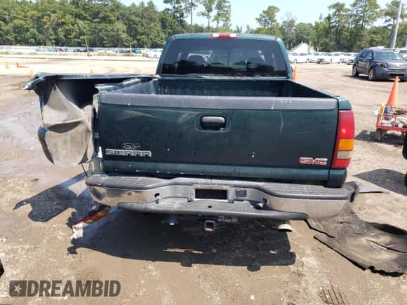2003 GMC Sierra 1500 SLE with VIN 2GTEC19V831401452, listed as a Copart auction lot 69661575 with 302,718 mi miles and Salvage title. Bid and sale history available at DreamBid. Image 6.