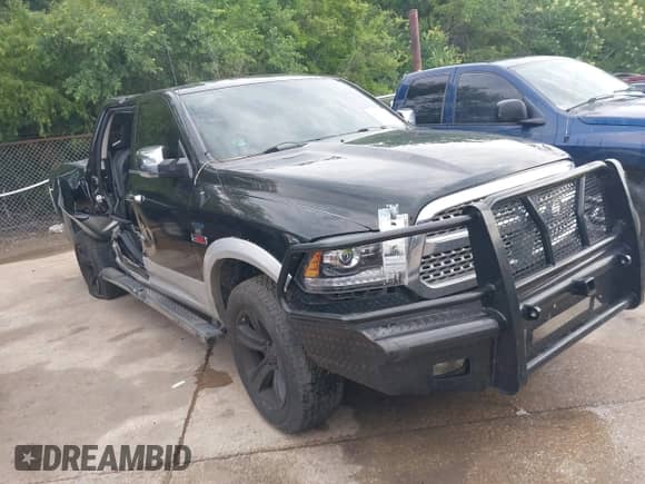 2014 Ram 1500 Laramie z VIN 1C6RR7NM7ES353887, wystawiony jako IAAI lot #42349659 z przebiegiem 206 055 mil mil oraz . Historia ofert i sprzedaży dostępna na DreamBid. Obrazek 1.